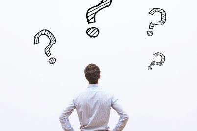 7141-back-view-of-man-looking-at-wall-of-question.jpg